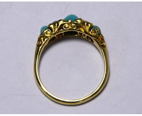 A Victorian turquoise and diamond ring, yellow gold with scroll setting and carved shoulders, size Mno damage; one smaller tu
