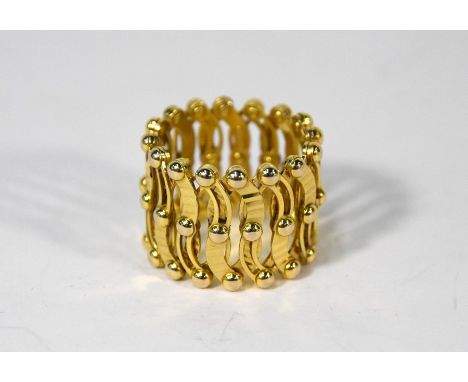 A 9ct yellow gold expanding ring/bangle formed of open rivetted links, maximum 7 cm diam, minimum 2cm, approx 8.6 g