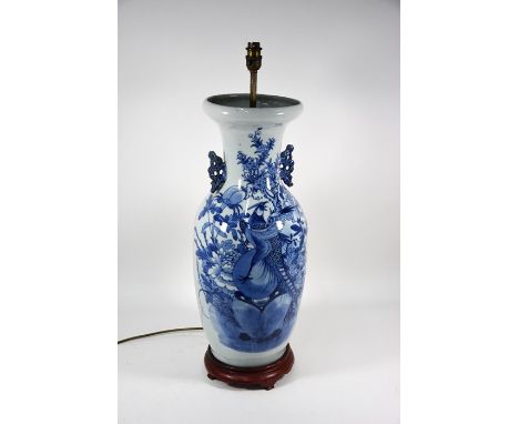 A large Chinese blue and white pale celadon ground baluster vase with stylised chilong handles mounted as a lamp on a hardwoo