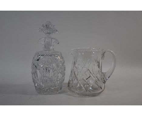 An Art Deco style cut glass decanter with fan-shaped stopper, 26 cm high, to/w a heavy cut glass water jug (2)Chip under corn