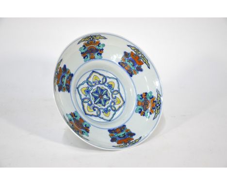 A Chinese ogee-shaped doucai bowl, painted in underglaze blue and polychrome enamels, the interior with a central medallion f