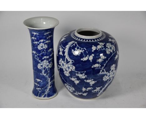 A 19th century Chinese Gu-shaped beaker vase, decorated with blossoming prunus trees on a blue cracked-ice ground with four-c