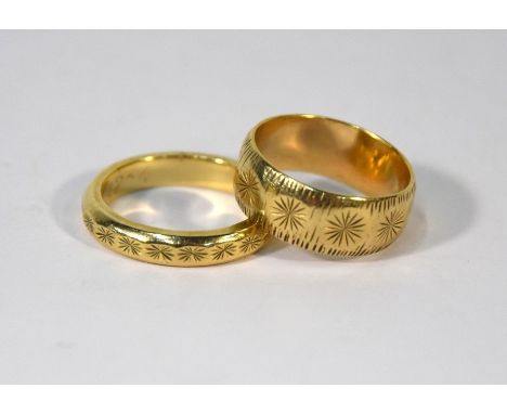 Two 9ct yellow gold wedding bands with incised decoration, one 8mm wide size P, the other 3mm wide size Q/R, approx 11.8g (2)