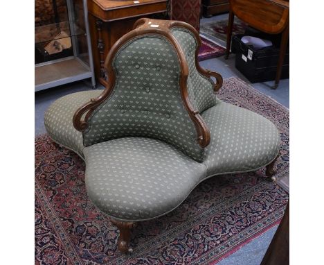 A late 19th century walnut framed button backed four cluster lobby sofa / conversation seat, raised on moulded legs to white 