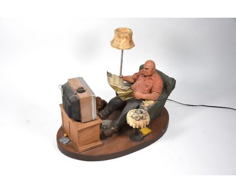 Michael Garman (b.1938 USA) - 'Evening News' a limited edition ceramic sculpture group of a man in untidy sitting room, readi