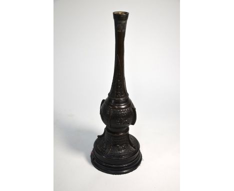 A Chinese archaistic bronze vase (as lamp) on circular hardwood stand, cast in relief with Buddhistic guardian lions on a den