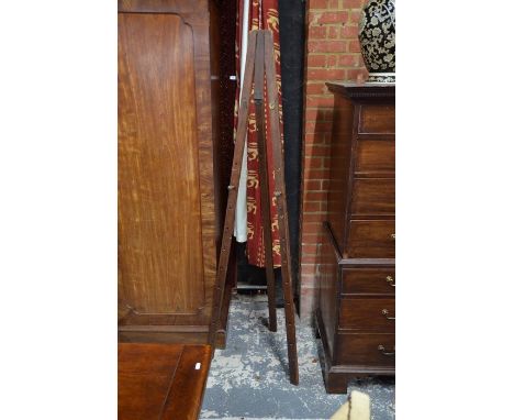 An antique stained pine folding easel, 182 cm