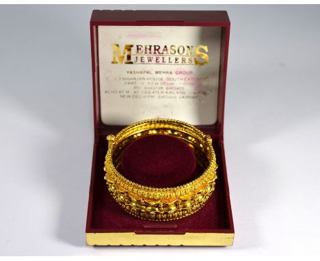 An Indian yellow metal filigree wide half hinged bangle, pin fastener, 2.8cm wide, 6.5 cm diam, 51.2g&nbsp;Good condition
