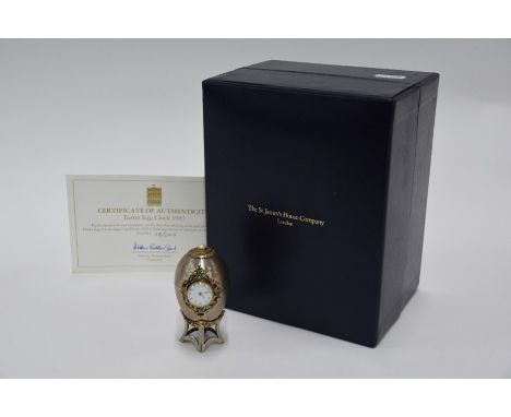 A cased silver and gilt 'Easter Egg Clock' by The St James House Company, London 1983, the quartz watch movement with&nbsp;17