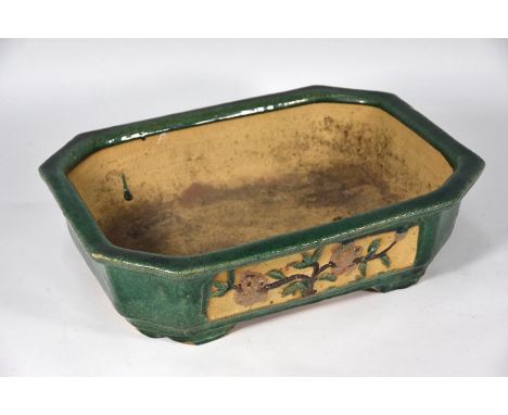 A 20th century Chinese canton stoneware green glazed bonsai bowl/pot of canted rectangular form standing on four bracket feet