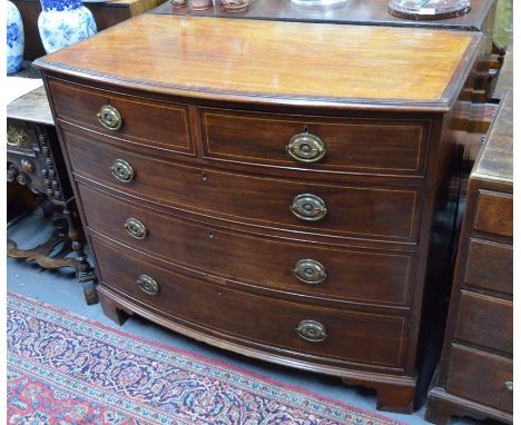 A 19th century rosewood cross banded mahogany chest of two short over three long graduated drawers, with oval brass backplate