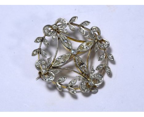 An Edwardian diamond set open circlet brooch, with four old marquise cut diamonds around a central old cut diamond to the cen