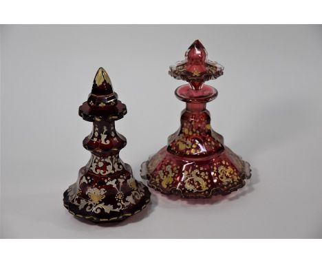 A 19th century Bohemian cranberry flash glass scent bottle and stopper with gilt and enamel foliate decoration, 18.5 cm high 