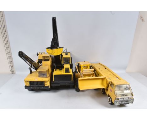 FOUR ASSORTED TONKA TOYS , two Mighty Tonka Toys lorry/truck mounted Grab Cranes, one complete and in working order, the miss