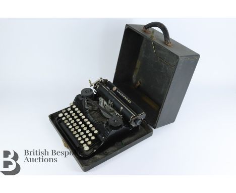 Vintage Underwood portable typewriter housed in the original case together with a later Erika touch typewriter housed in the 