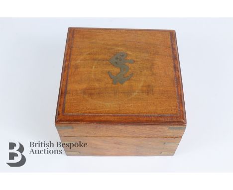 20th century brass compass, housed in a teak box, approx 12 x 12 x 8 cms.