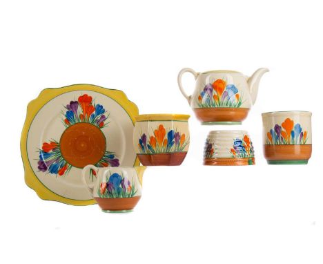 BIZARRE BY CLARICE CLIFF WARE,a group comprising tea pot (lacking lid), octagonal bowl, cream jug, honey pot (lacking lid), s