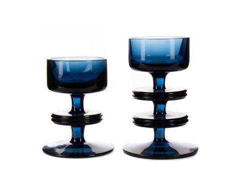 TWO BLUE GLASS CANDLESTICK BY RONALD STENNETT WILSON FOR WEDGWOOD,two and one ring respectively, the taller 12cm high (2)Cond