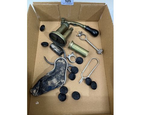 A collection of antique cartridge reloading tools extractors etc. military badges and a leather purse