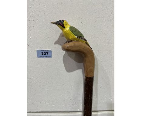 A hazel walking stick, the pommel carved as a woodpecker. 51' long