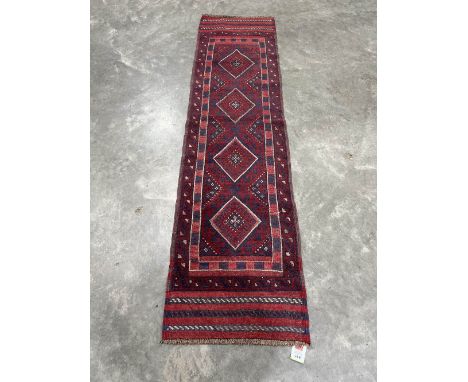 A Meshwani carpet runner. 2.44m x 0.63m