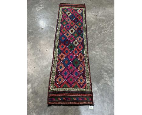 A Suzni Kilim carpet runner. 2.22m x 0.62m