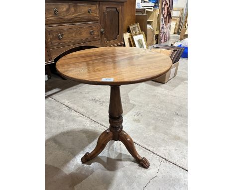 A 19th century mahogany occasional table on turned column and tripod support with volute feet. 21¼' diam.