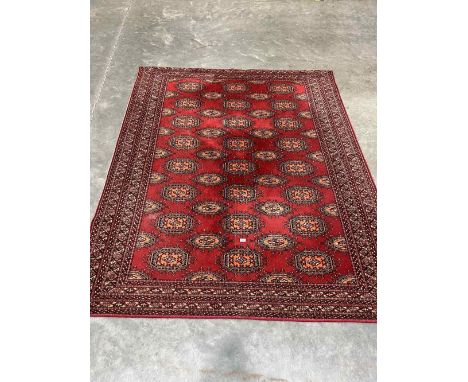 An eastern style red ground carpet. 96' x 78'