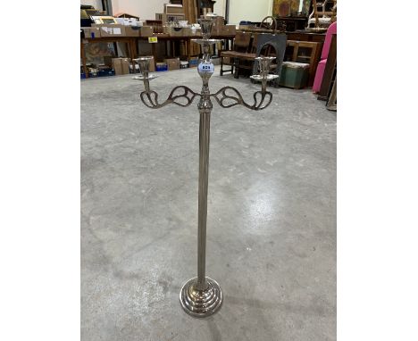 A plated floor standing three light candelabrum. 39½' high