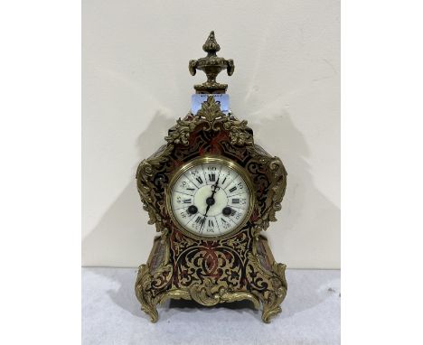 A French Boulle-work tortoiseshell and cut brass mantle clock with brass drum movement striking on a coiled gong. 12½' high. 