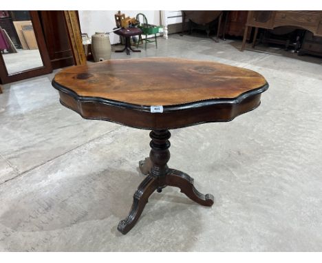 A French walnut tripod table with shaped top. 35' wide