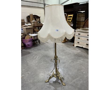An early 20th century brass telescopic lamp standard