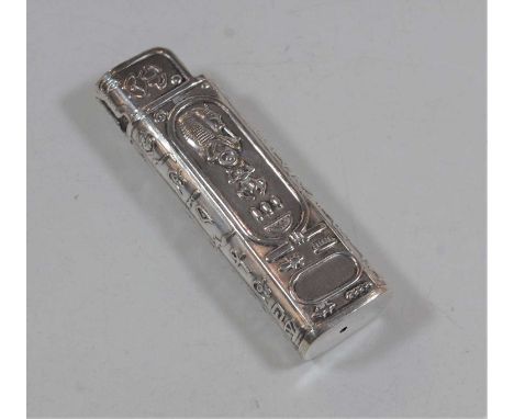 A 20th century Egyptian white metal pocket cigarette lighter sleeve, relief decorated with Egyptian symbols, length 8cm