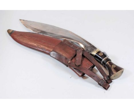 A 20th century kukri with leather scabbard 