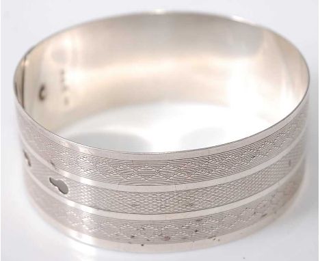 A Charles Horner engine turned silver bangle, 31g, 6.3cmCondition report: With Charles Horner makers mark and Chester 1918 ha