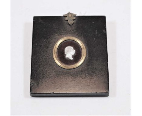 A 19th century cameo portrait miniature of a gentleman in profile within an ebonised surround, max dimensions 9x8cm