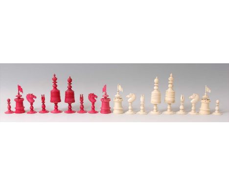 A 19th century English carved bone chess set, one side stained red and the other left natural (one red pawn is poor quality r