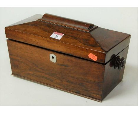 A Victorian rosewood tea caddy, of sarcophagus form, the hinged lid opening to reveal a central mixing bowl flanked by two do