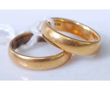 Two 22ct gold wedding bands, gross weight 14gCondition report: Smaller ring – size J/K, 7.4g.Larger ring – size L/M, 6.2g.