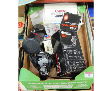 A box of cameras and accessories to include Canon AE1, Vivitar 285 zoom autoelectric flash, etcCondition report: Canon camera