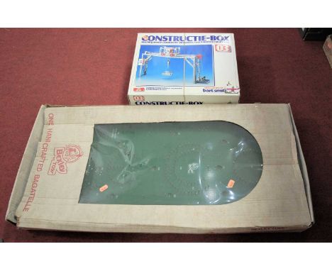 A Constructie-Box toy crane set; together with a Constructie-Box lorry set; and a bagatelle board (3)