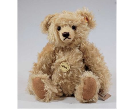 A Steiff blond mohair teddy-bear, with adjustable arms 