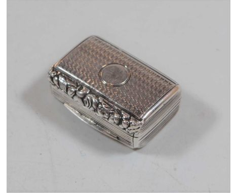 A late George III silver vinaigrette, having engine turned decoration and vacant cartouche, the hinged lid opening to reveal 