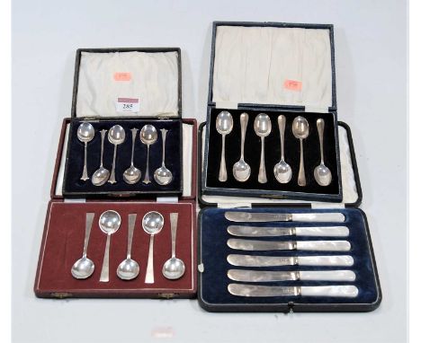 A cased set of silver teaspoons, Sheffield 1920; together with a cased set of six silver bladed butter knives with mother of 