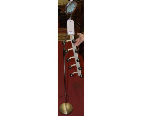 A modern chromed metal floor light; together with a cream painted metal wall mounted coat-rack (2) 