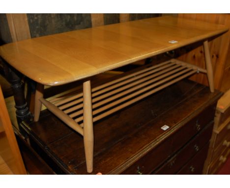 An Ercol blond elm low coffee table, having laddered undertier, w.103cm    Condition Report / Extra Information  Complete and