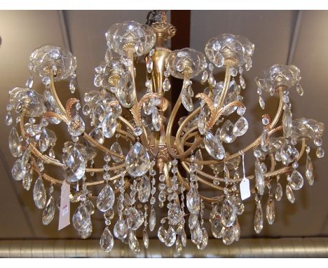 A French brass and cut glass hanging multi-light electrolier, having shaped branches with leaf capped terminals, approx drop 