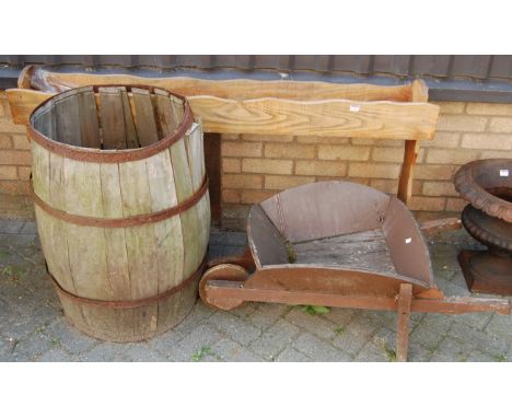 An elm standing long plant trough; together with a rustic wheelbarrow and a metal bound barrel (3)