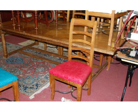 An extremely large faded walnut and inlaid rectangular dining table raised on turned and square cut supports, length 255cm, t