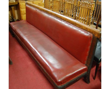 A late Victorian mahogany framed railway waiting room bench, rexine upholstered, with turned feet, w.236cm. Provenance: Ex-Bu